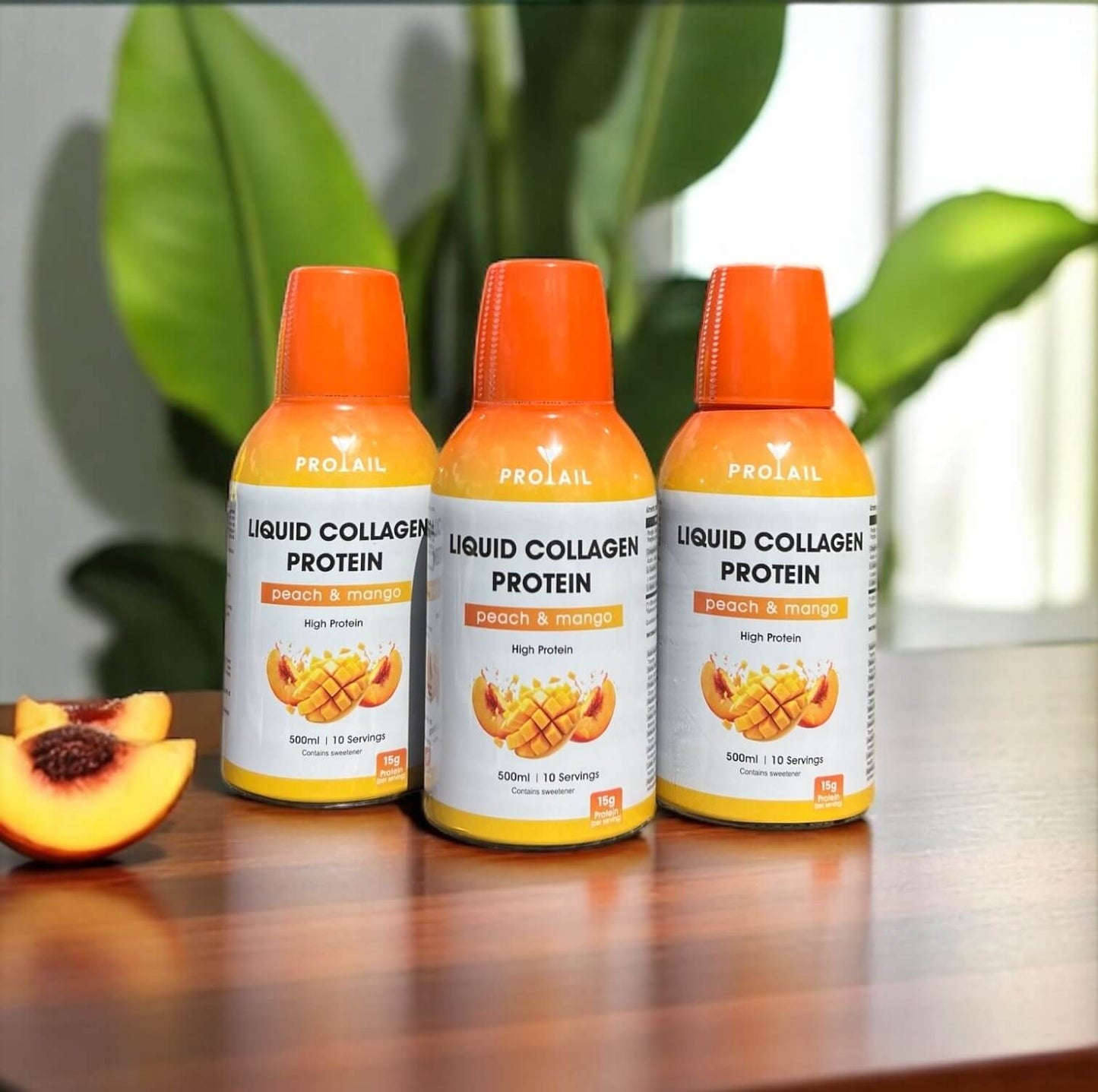 Three bottles of Protail Liquid Collagen Protein with peach and mango flavor on a wooden surface.